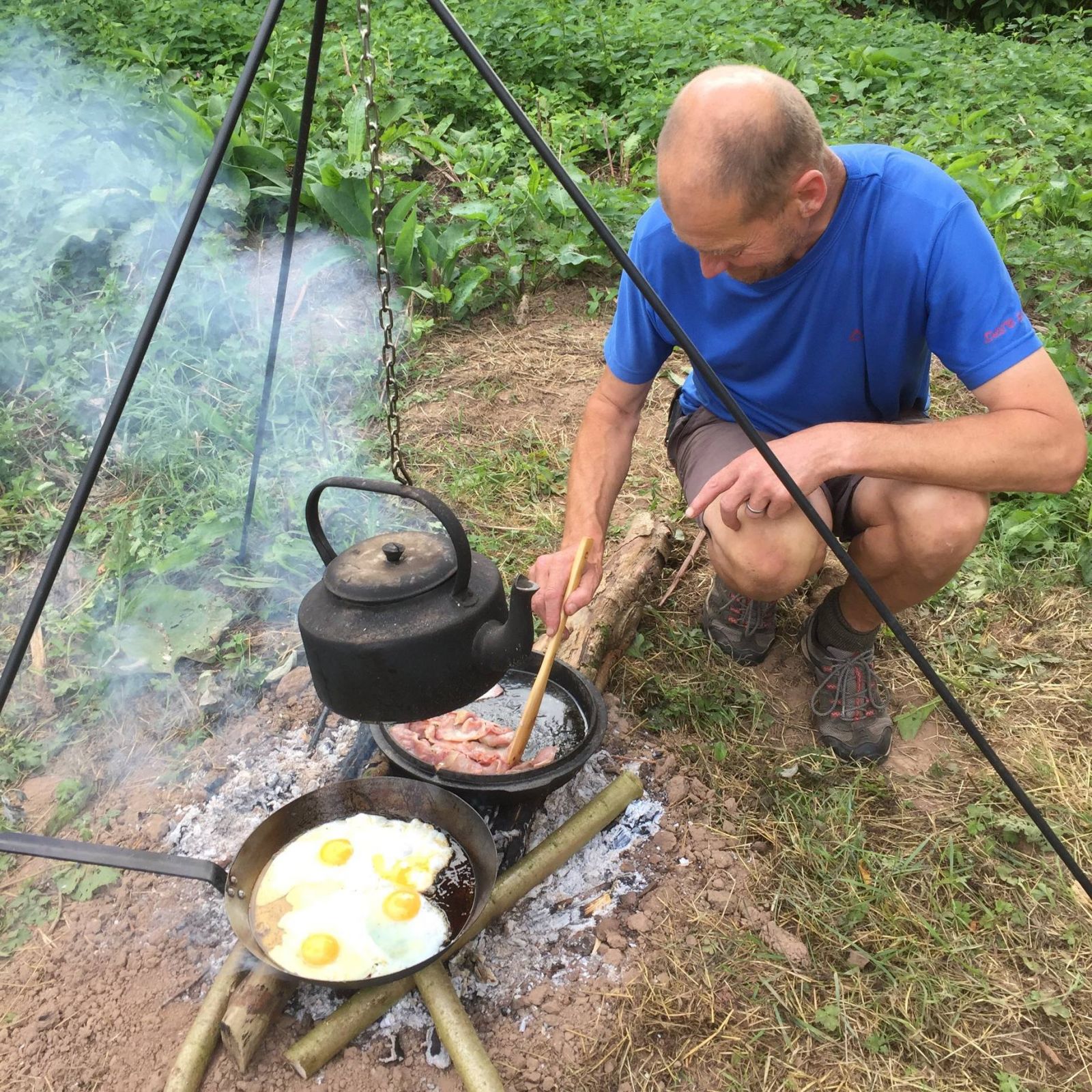 Cooking breakfast on canoe expedition