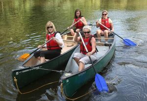 Ladies ina rafted canoe