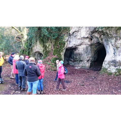 Exploring King Arthurs cave on a guided walk.