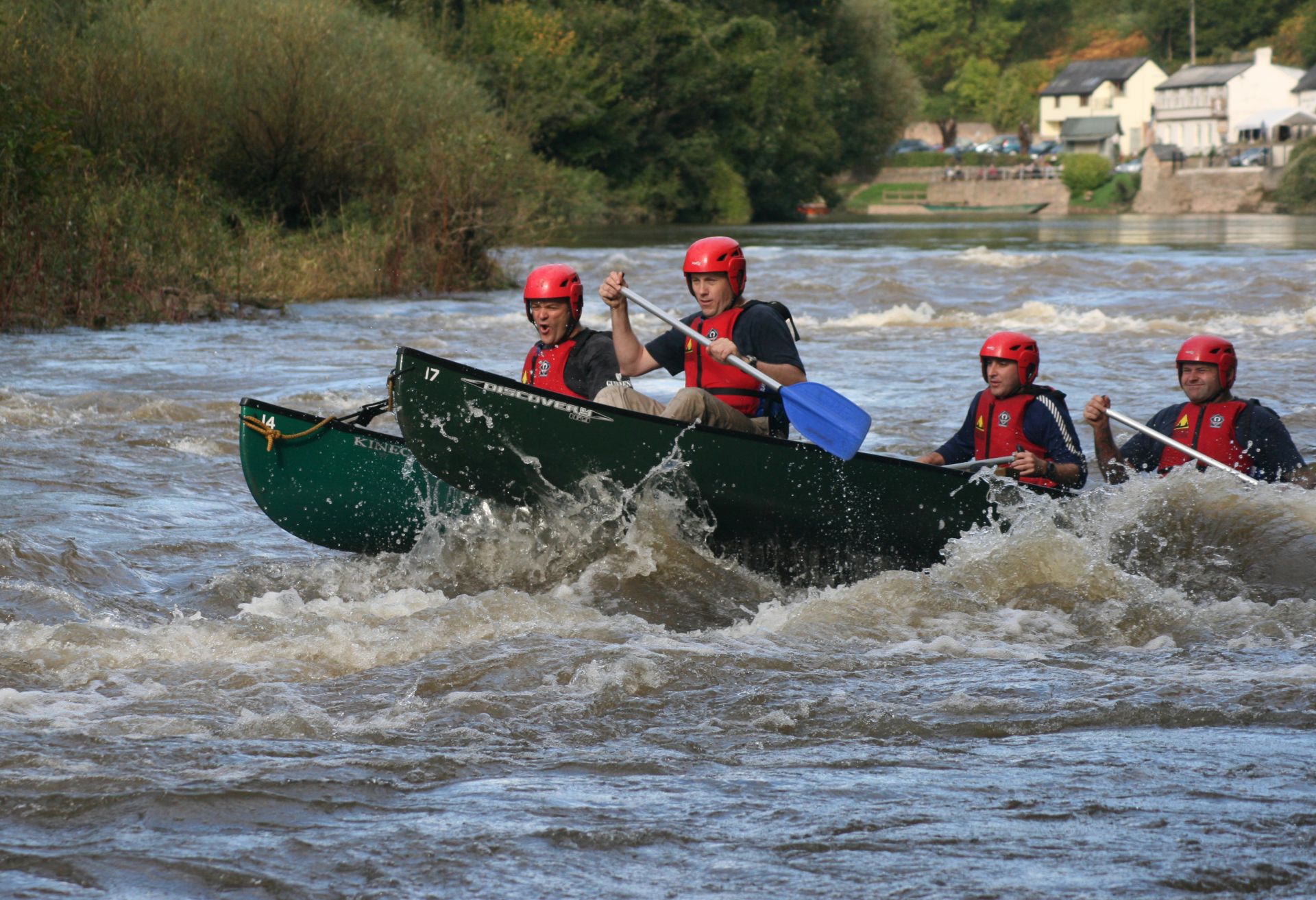 Rafted canoe having fun in the rapids at Symonds Yat